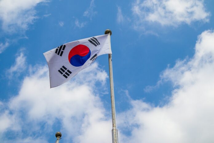 white red and blue flag under blue sky during daytime